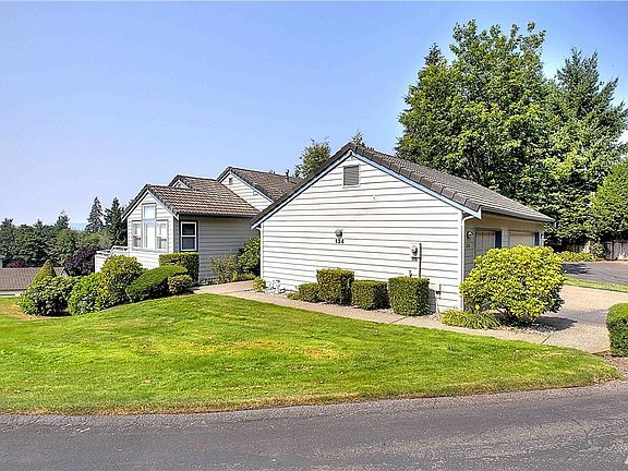 End unit corner condo with private driveway and 3-car garage.