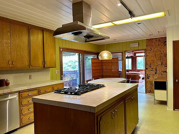 Tribe-size kitchen with island.