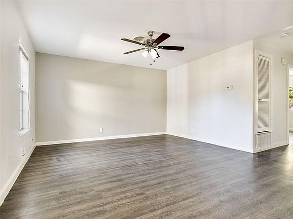 Recent paint, fan, modern wood laminate flooring throughout. No Carpet.