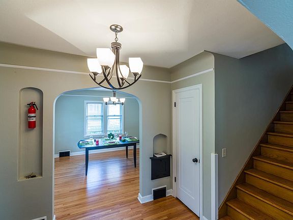 Foyer with entryway closet and oak floors.