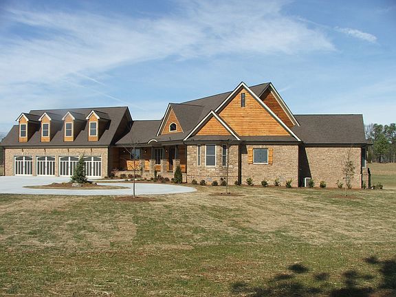 4 Sides Brick, cedar & stone accents