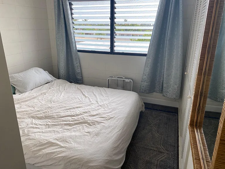 Smaller bedroom, shown with a california king bed