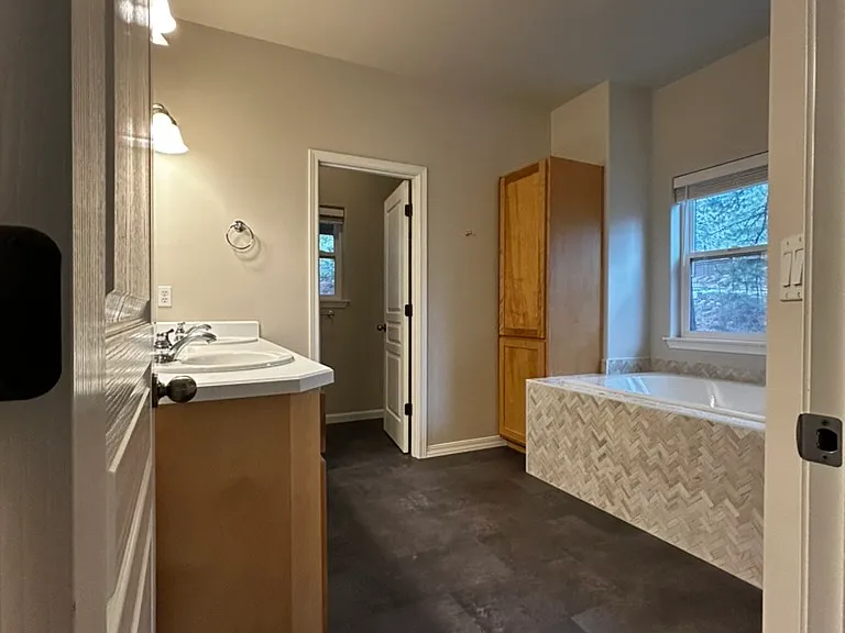 Primary bath - Soaker tub, dual vanity, shower, pocket toilet and walk in closet.