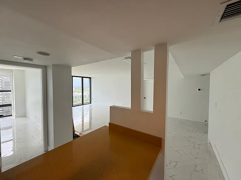 Open-concept KITCHEN flows seamlessly into the home's social areas. Leaves you feeling less claustrophobic & great for hosting/socializing while using the kitchen
