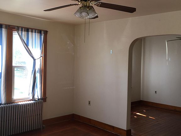 looking from living room thru arch to dining room
