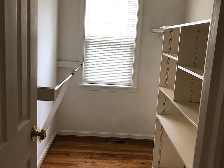 Master bedroom walk in, sunny closet.