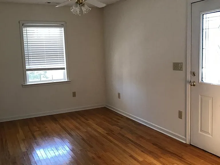 Separate Dining Room with Gas Dryer behind Plantation Bifold