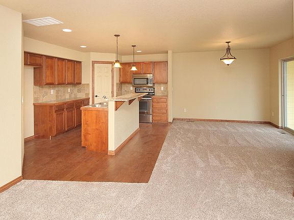 Kitchen opens up into dining room and living room