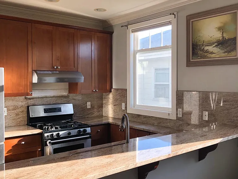 Kitchen, featuring stainless steel appliances, granite counters, deep sink, and Hansroghe faucets