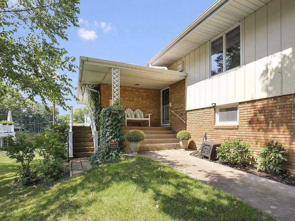 A welcoming front porch leads to main floor of the home. Stairs on the side access a balcony that runs the length of the house with stairs leading to the back yard on the other end. A sliding glass door from the dining area opens onto the balcony.