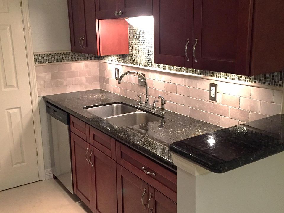 Kitchen includes under cabinet lighting, large/deep stainless steel sink