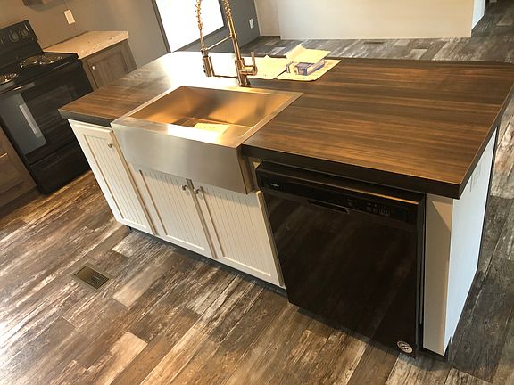 Kitchen island with farmhouse sink and dishwasher
