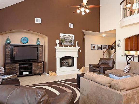 This home has been painted with custom decorator interior accent paint. The gas log fireplace is one of the focal points of this room.