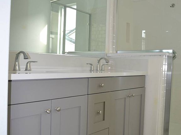 ElevationHomesite 18 master bathroom also has stylish grey cabinets.