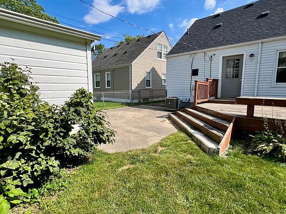 Fenced backyard with deck