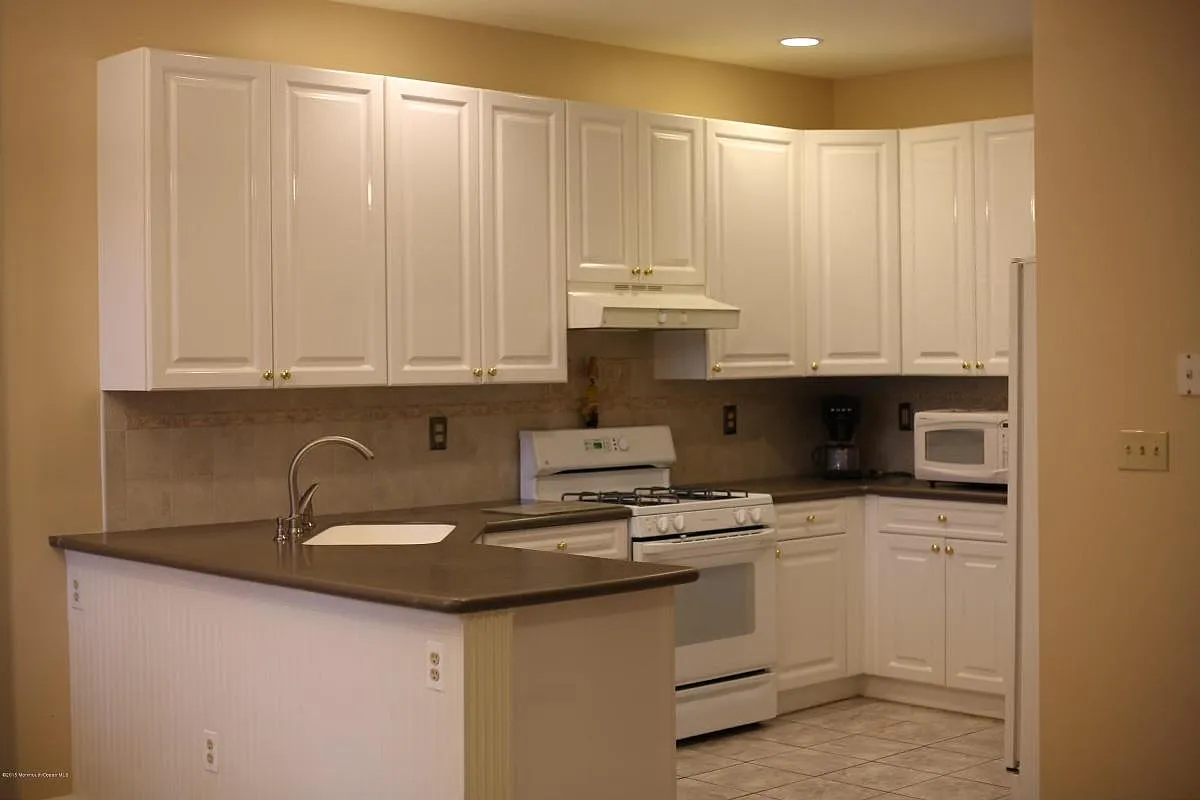 Modern kitchen with corian countertops - Nutmeg Ln