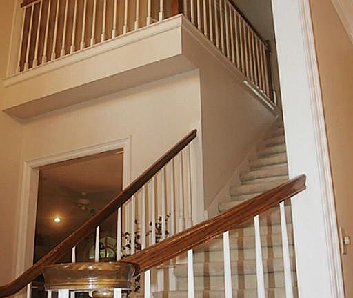 Welcoming two story entry with wood floors.