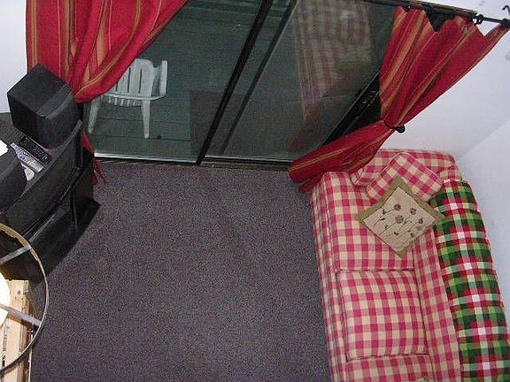 Looking down from loft onto living area.