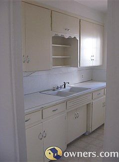 Kitchen has lots of cabinet space..
