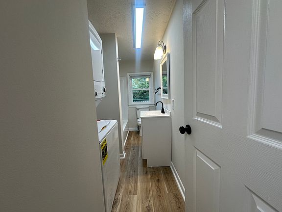 Bathroom with stackable washer /dryer.