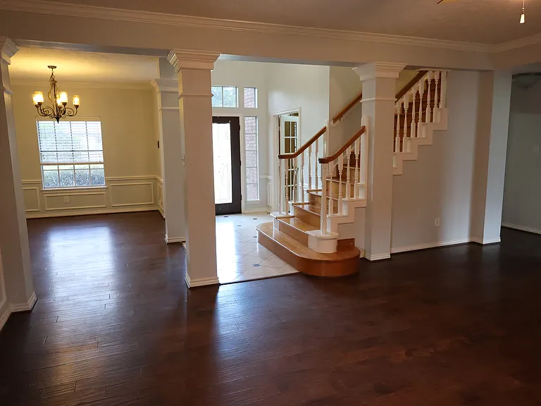 Opening back into the main house, but still focused on the front entry. The formal dining room is to the left. You re standing in the family room.