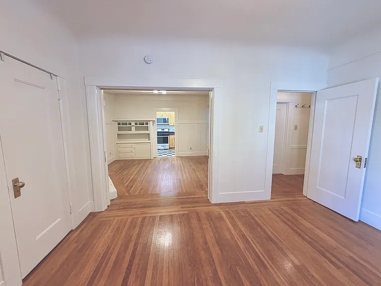 Bedroom with open pocket doors