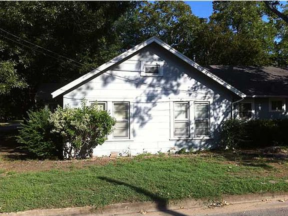 Side View of House and Curbed Yard