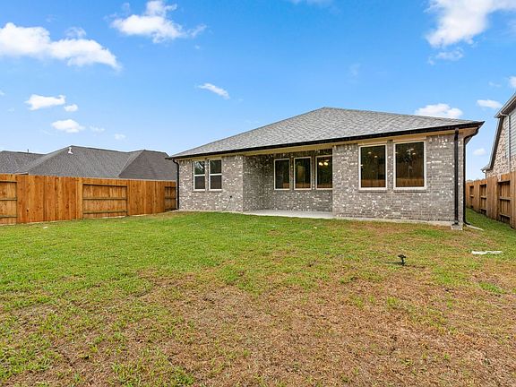 Come and see this spacious backyard with its beautiful covered patio. There is plenty of room for k