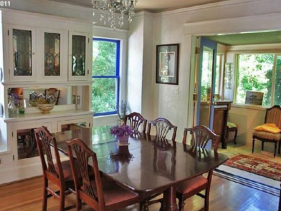 Dining room opens to sunroom and living room-has awesome built-in