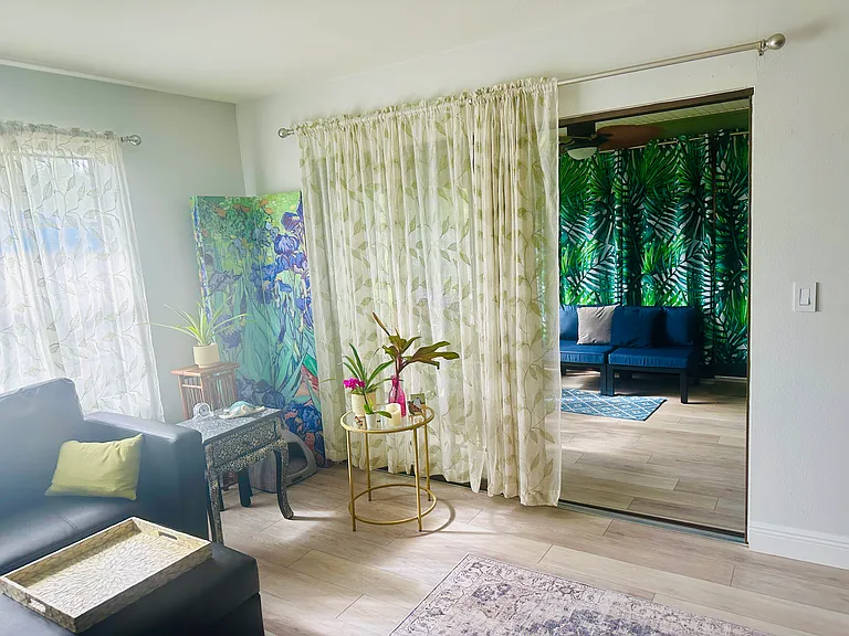 Living room looking into lanai/Florida room.