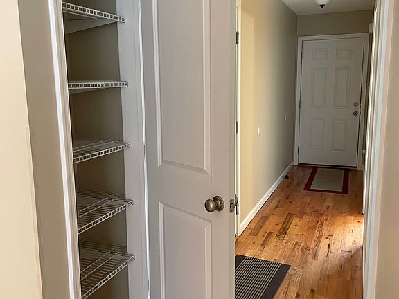 Looking down the entrance hallway, front door ahead. Kitchen Pantry
