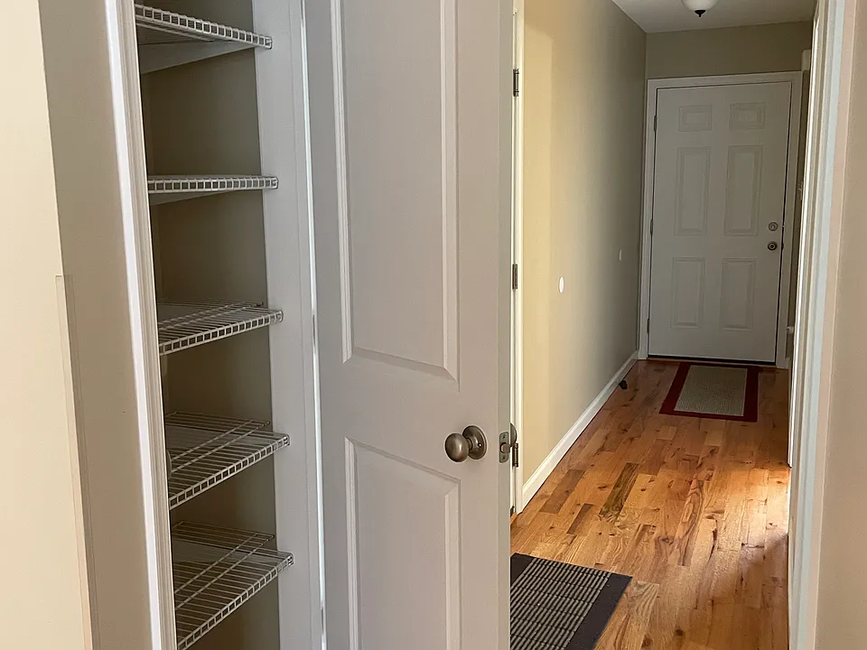 Looking down the entrance hallway, front door ahead. Kitchen Pantry