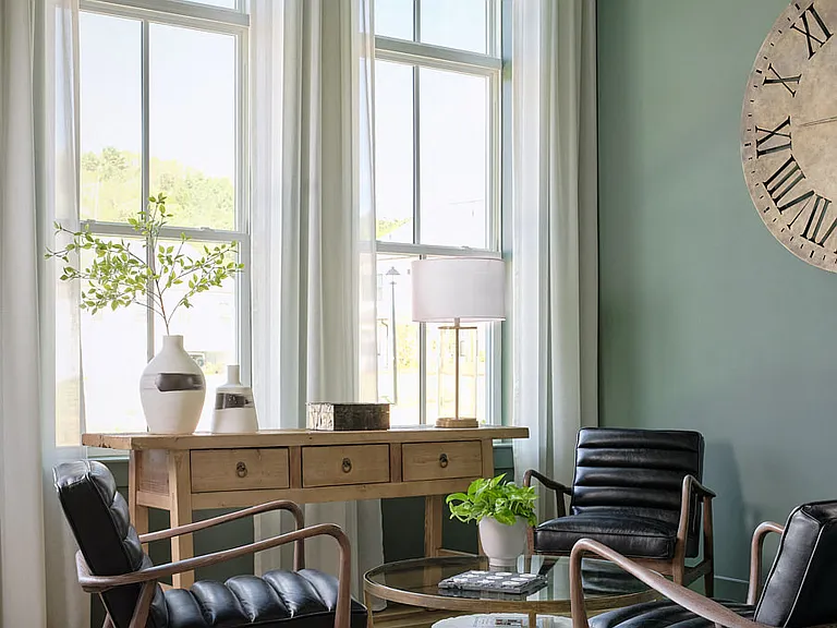 Stylish clubhouse lounging area with contemporary seating and natural light.