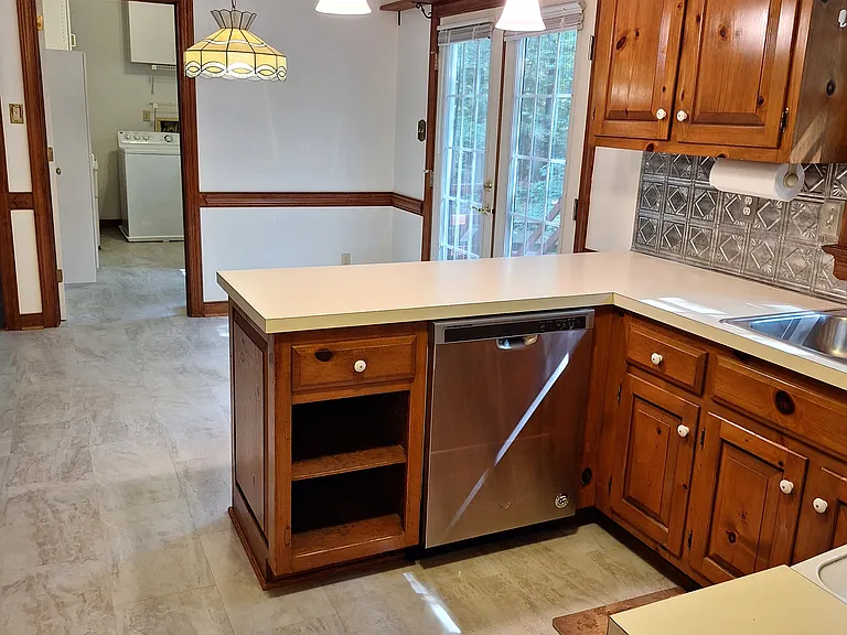 Kitchen. Beyond the breakfast area, the Laundry room is visible in the background.