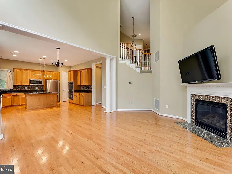 Great Room/ Family Room with 19' cathdral ceiling, lots of windows to let in natural light