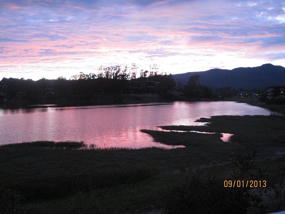 Summer sunset over water with view of Mt. Tam