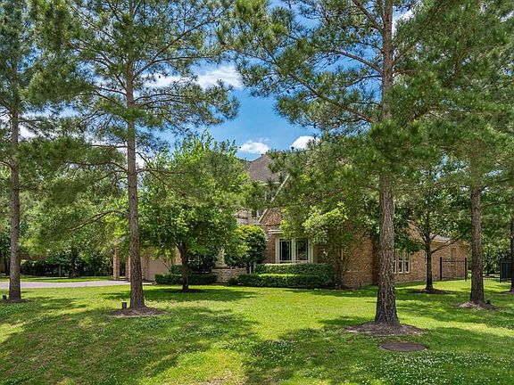 Your dream home awaits you on an almost one acre lot with matures trees all around!