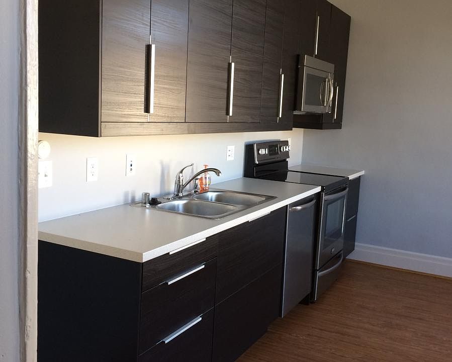 Sleek modern kitchen with plenty of cabinet space plus a lar