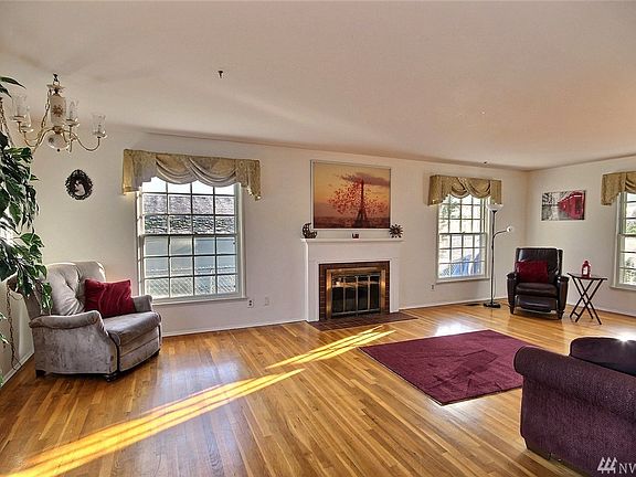 This is a picture looking from the dining room to the living room towards the front of the home.