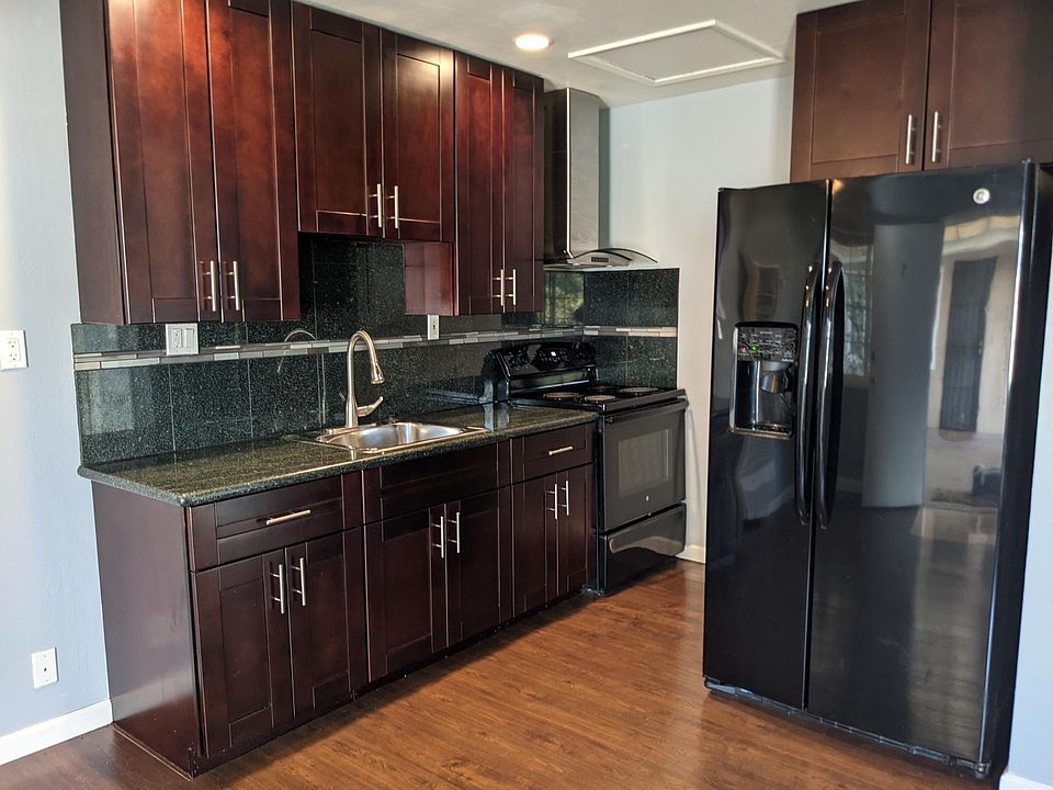 Renovated kitchen with full size Refrigerator.