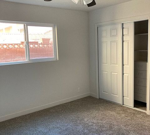 New sliding closet doors. Closet has built-in drawers and shelves.