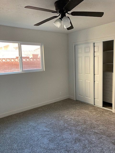 New sliding closet doors. Closet has built-in drawers and shelves.