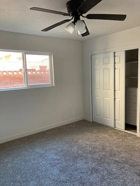 New sliding closet doors. Closet has built-in drawers and shelves.