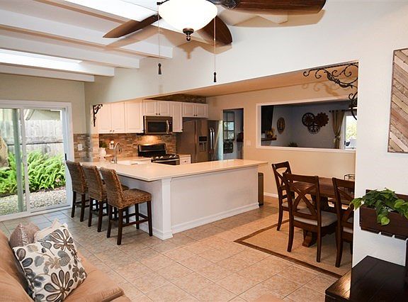 Everybody's favorite floor plan concept.  The Chef will be the center of every party... there are Acres of Countertops, custom cabinetry, and the traffic flows around the see through partition to the Living Room.... to handle the largest of get-together's