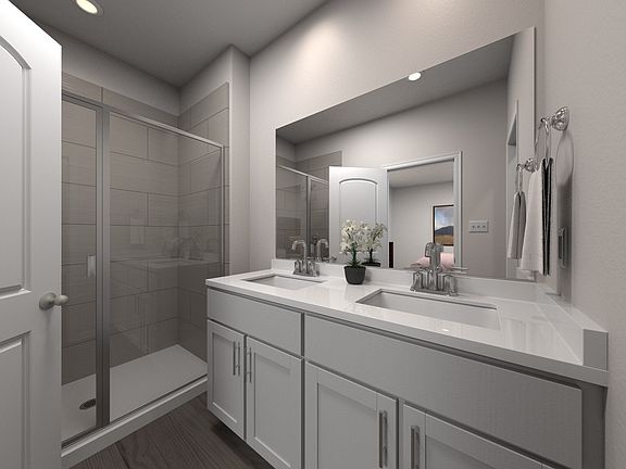 The primary bath offers a large walk-in shower.