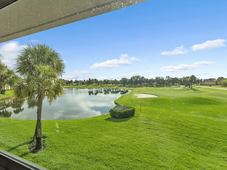 Enjoy lake and golf course views from the living room & bedroom!