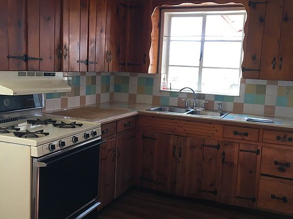 Kitchen with Rustic cabinets