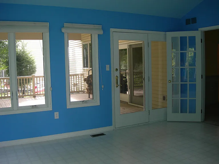 Sunroom with Access to Covered Deck. This room has been repainted.
