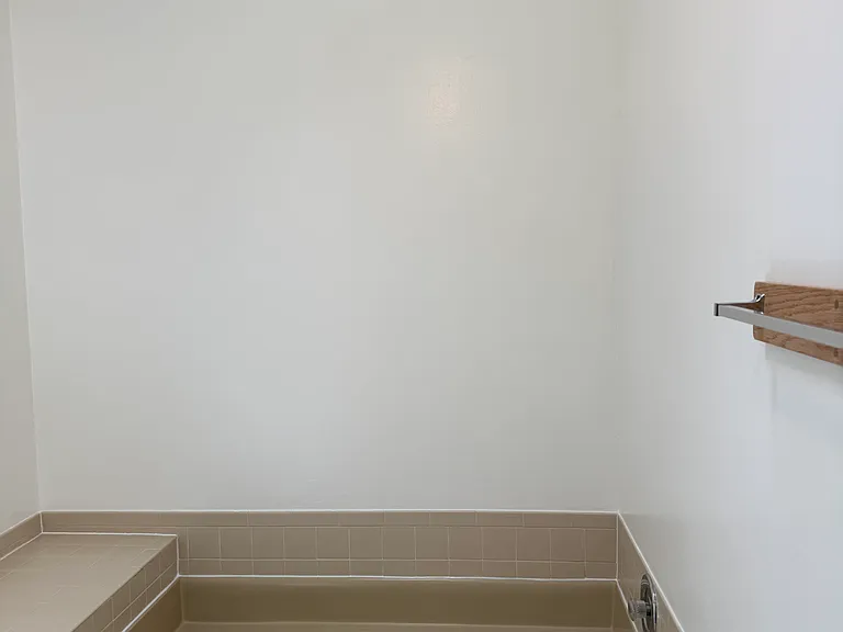 Tiled in bench/shelf paired with soaker tub for ultimate relaxation!