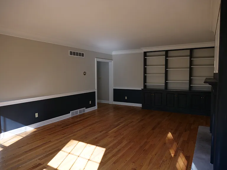 Large living room with gas fireplace and beautiful view of Mill Creek Park. Plenty of shelving and cabinetry.